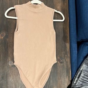 Primark tan turtleneck body suit. Bought February 2022. Brand new, never worn!